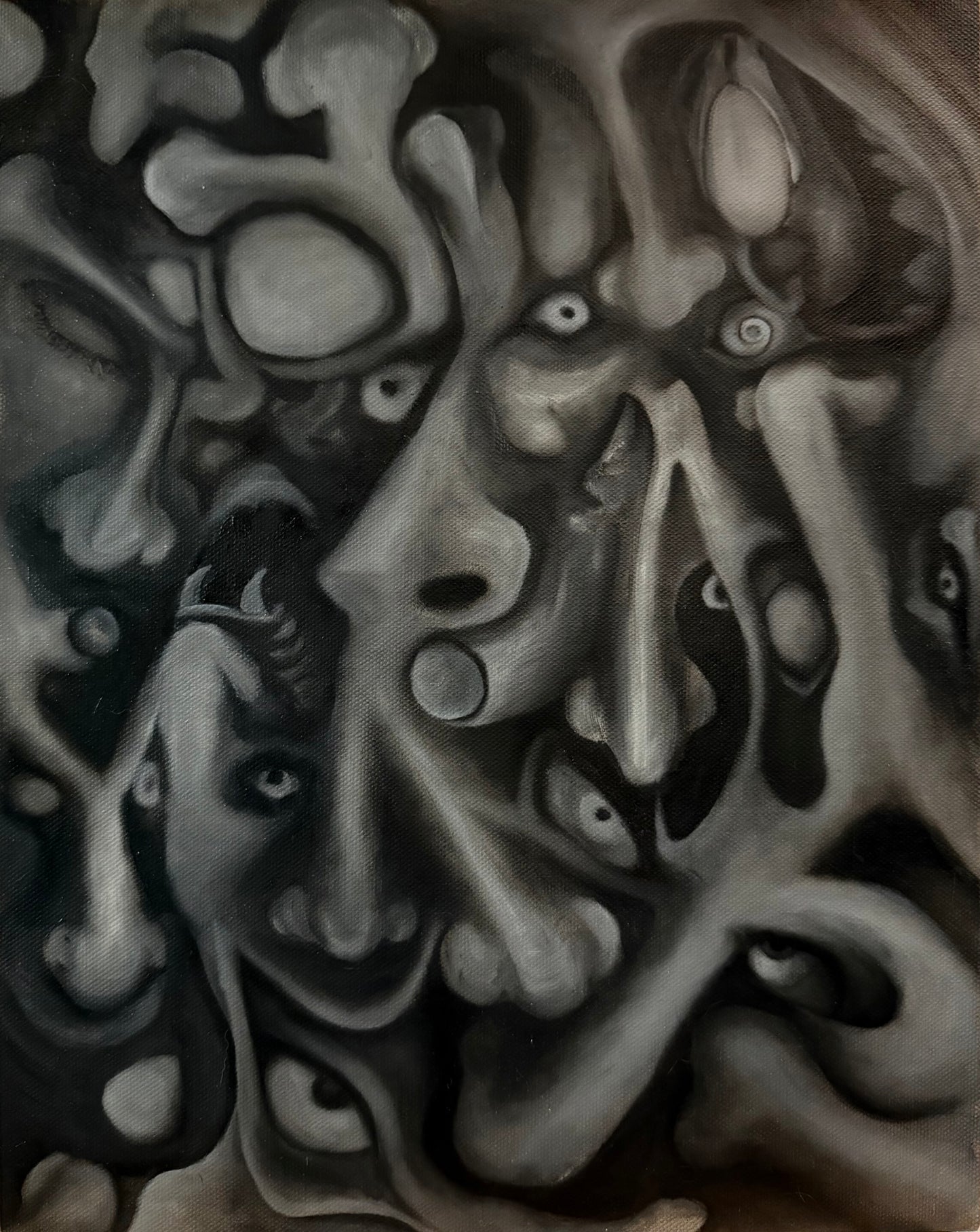 Abstract black and white artwork with distorted faces and organic shapes